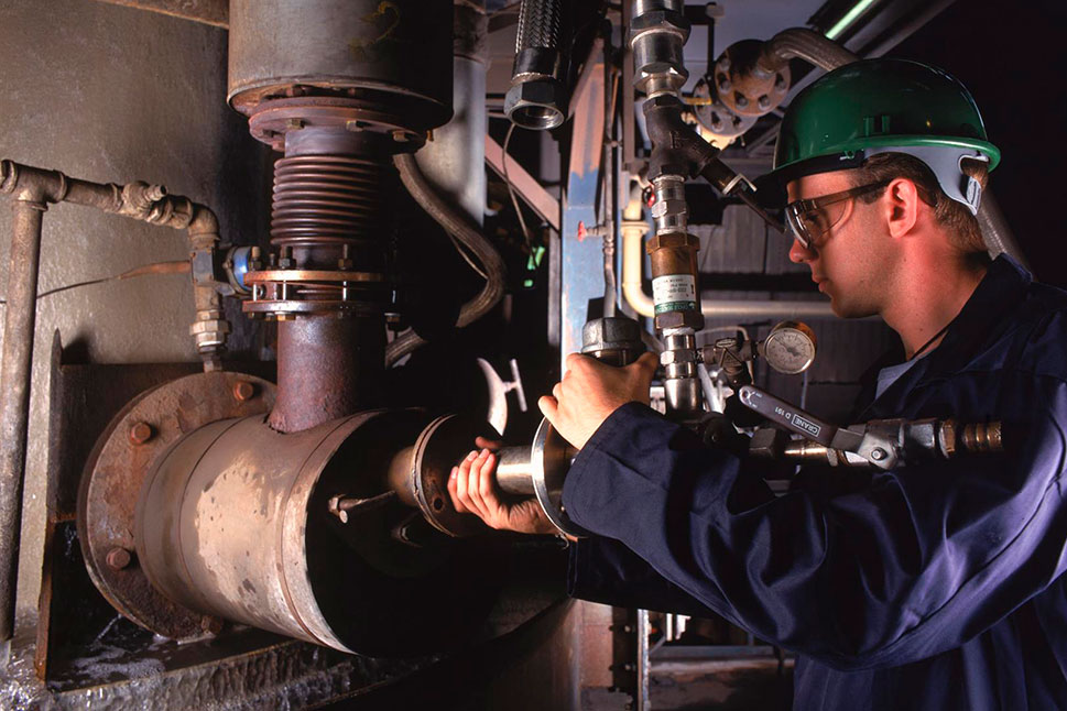 Operator adjusting an Air Products Air Products Cupola Oxy-fuel System  or APCOS burner
