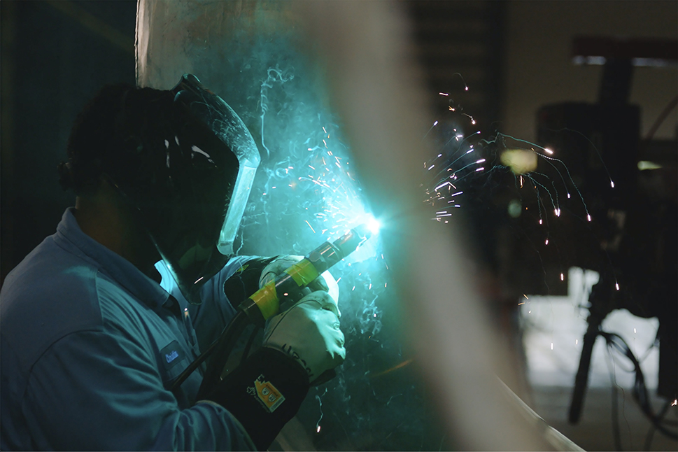 Welder working on LNG heat exchanger at Port Manatee facility